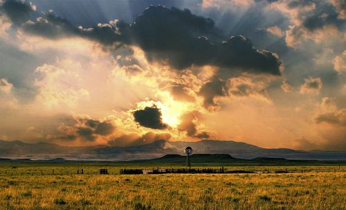 Scenic view of sunset over land