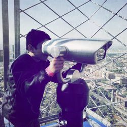 Man photographing through camera