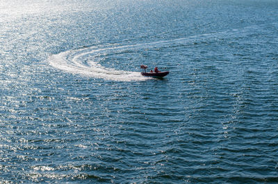 High angle view of people sailing on sea