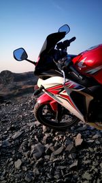 Low angle view of motorcycle against sky