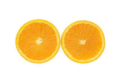 Close-up of orange slice against white background