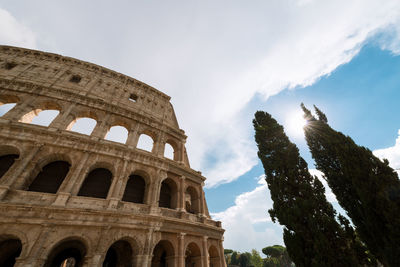 Low angle view of coliseum against sky