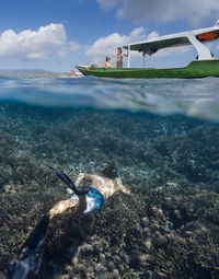 People swimming in sea