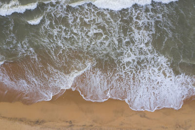 Waves breaking on beach