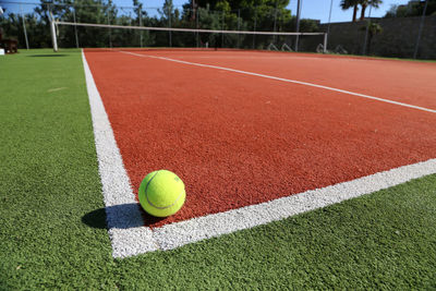 Close-up of tennis ball on playing field