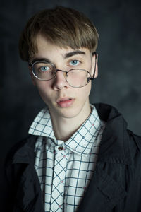 Portrait of young man wearing eyeglasses