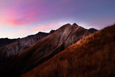 Scenic view of mountains against sky during sunset
