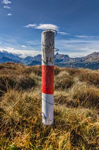 Lifeguard hut on landscape against sky