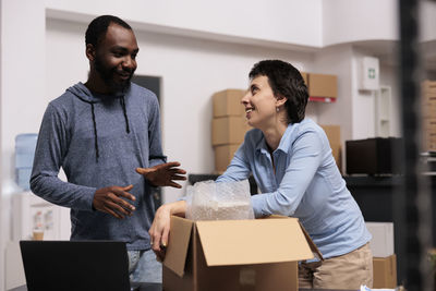 Side view of young man working in office