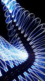 Low angle view of illuminated ferris wheel