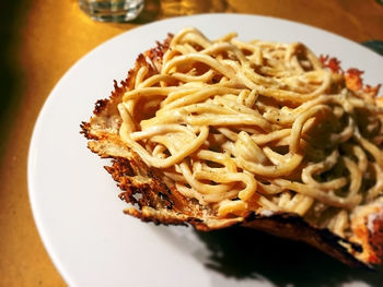 Close-up of noodles in plate on table