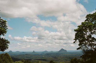 Scenic view of glasshouse mountains landscape against sky