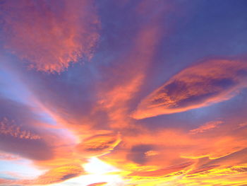 Low angle view of dramatic sky during sunset