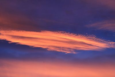 Low angle view of cloudy sky at sunset