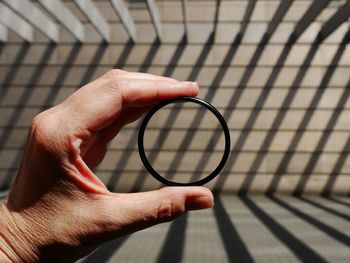 Close-up of hand holding eyeglasses