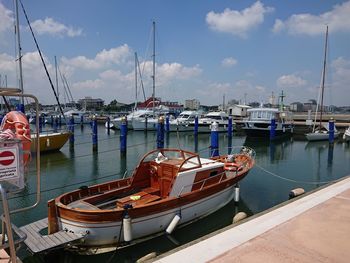 Boats moored at harbor