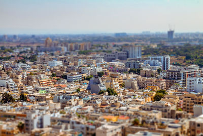 High angle view of city buildings against sky