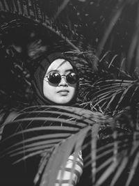 Portrait of young woman wearing sunglasses