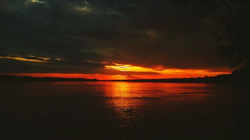 Scenic view of sea against romantic sky at sunset