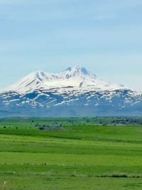 Scenic view of snowcapped mountains against sky