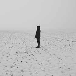 Silhouette of woman on beach