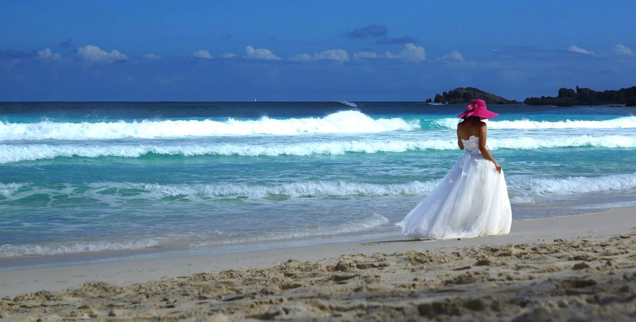 water, sea, wave, horizon over water, beach, surf, sky, splashing, motion, shore, beauty in nature, scenics, blue, one person, nature, vacations, cloud - sky, cloud, tranquil scene, day