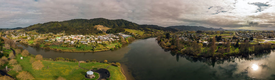 High angle view of river amidst buildings against sky