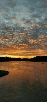 Scenic view of lake against romantic sky at sunset