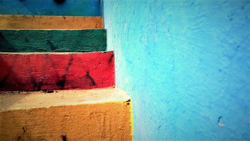 Colorful steps by wall