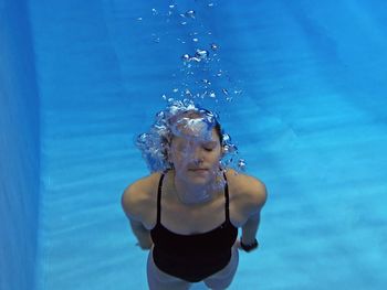 Young woman in swimming pool