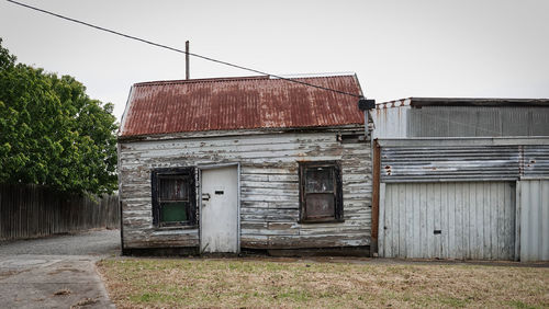 Abandoned building against clear sky