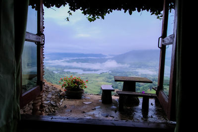 Scenic view of building seen through window