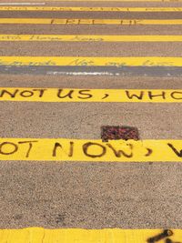 High angle view of yellow text on road