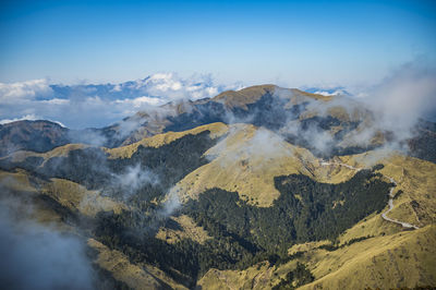 Aerial view of volcanic mountain range against sky