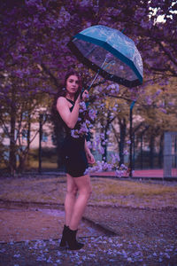 Portrait of woman standing in park