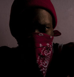 Close-up portrait of teenage girl against wall