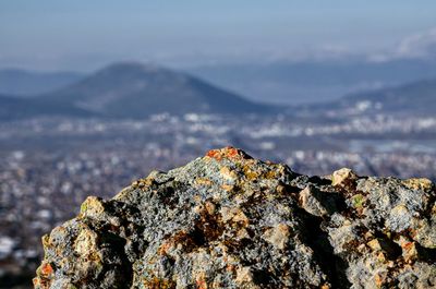 Close-up of rock against sky