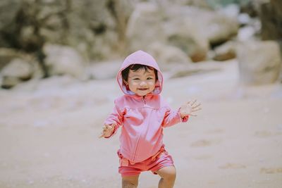 Portrait of girl walking at beach