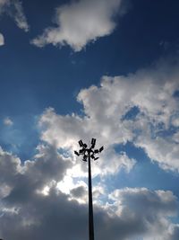 Low angle view of silhouette street light against sky