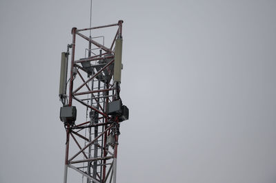 Low angle view of crane against clear sky