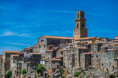 Low angle view of buildings against blue sky