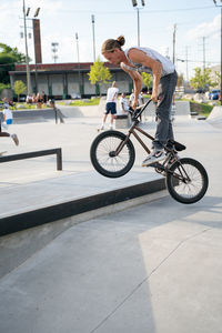 Side view of man riding bicycle