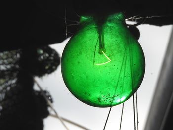 Low angle view of illuminated hanging light