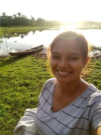 Portrait of smiling woman in lake