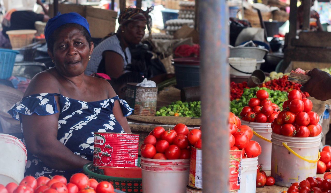 food and drink, healthy eating, market, market stall, fruit, food, real people, retail, container, freshness, wellbeing, for sale, one person, business, incidental people, day, red, vegetable, lifestyles, outdoors, sale, retail display, street market