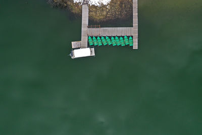 Aerial drone view of a lake boat dock. flying above a vessel pier
