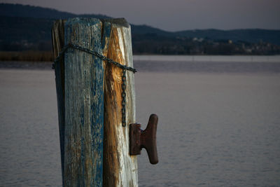 Close-up of wooden post in lake