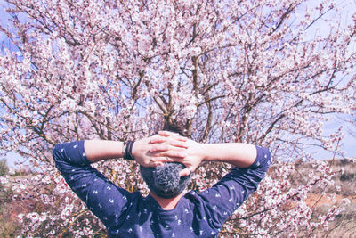 Full length of woman on cherry blossom