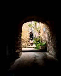 People walking in tunnel