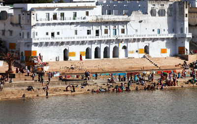 Pilgrims at pushkar lake on sunny day